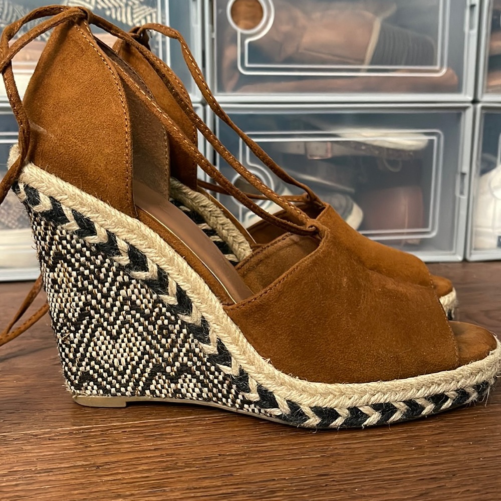 Sugar wedges with brown suede and laces up around ankle.